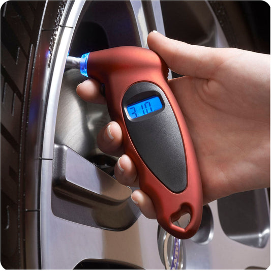 Product Image – Image showing a hand holding the product in red colour and testing the pressure on a tire.