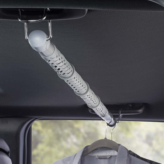 Product Image – Image showing the product molded in grey plastic installed inside a vehicle with clothes on hangers to the right.